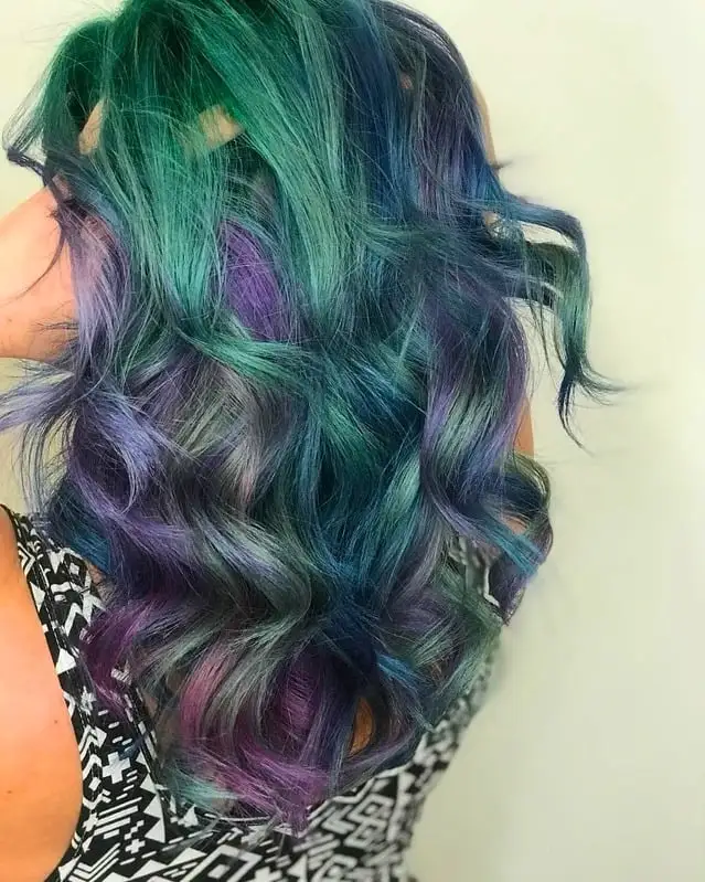 Hair dyed with vibrant, multi-colored fantasy hues.